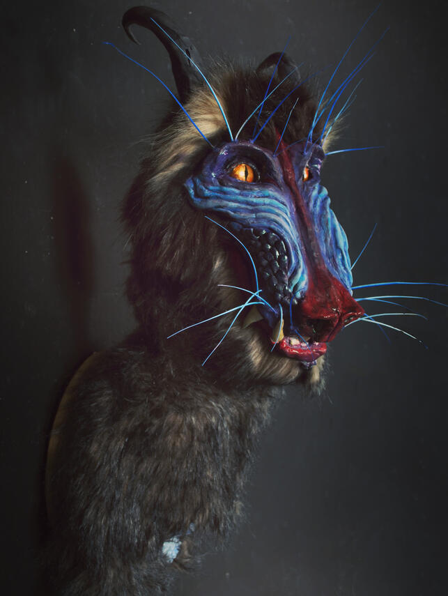 a friendly sculpture commission of a hybrid baboon dragon